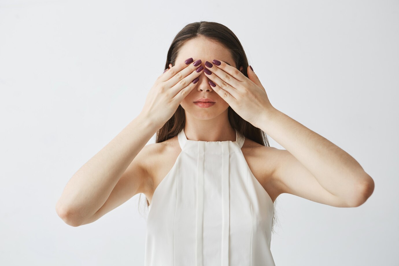 portrait-young-brunette-girl-covering-eyes-with-hands_176420-9891.jpg